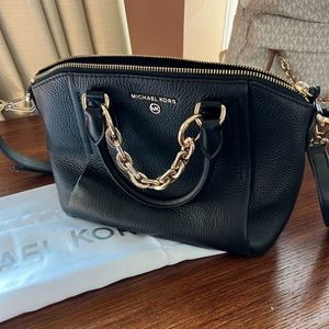 Sienna medium messenger. Leather. Only used twice. Retails $298